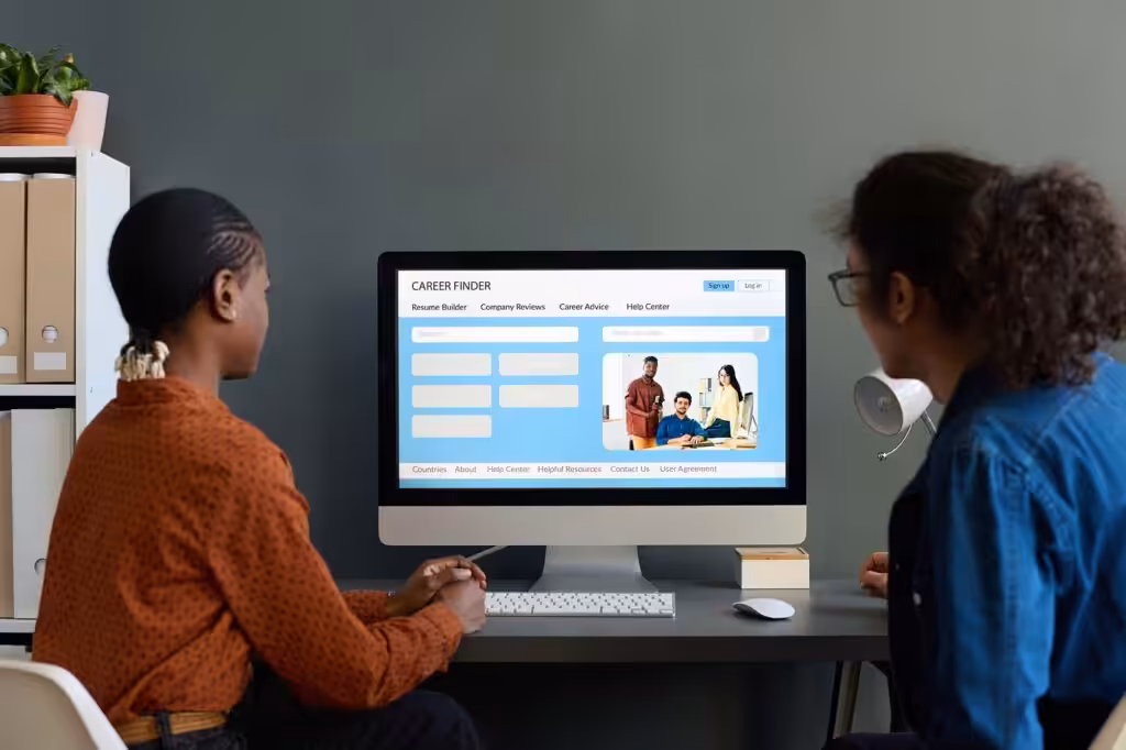 What is a CMS? Two people using PC