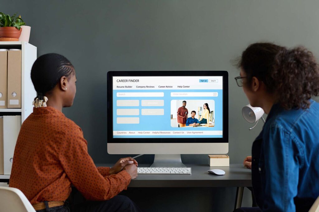What is a CMS? Two people using PC